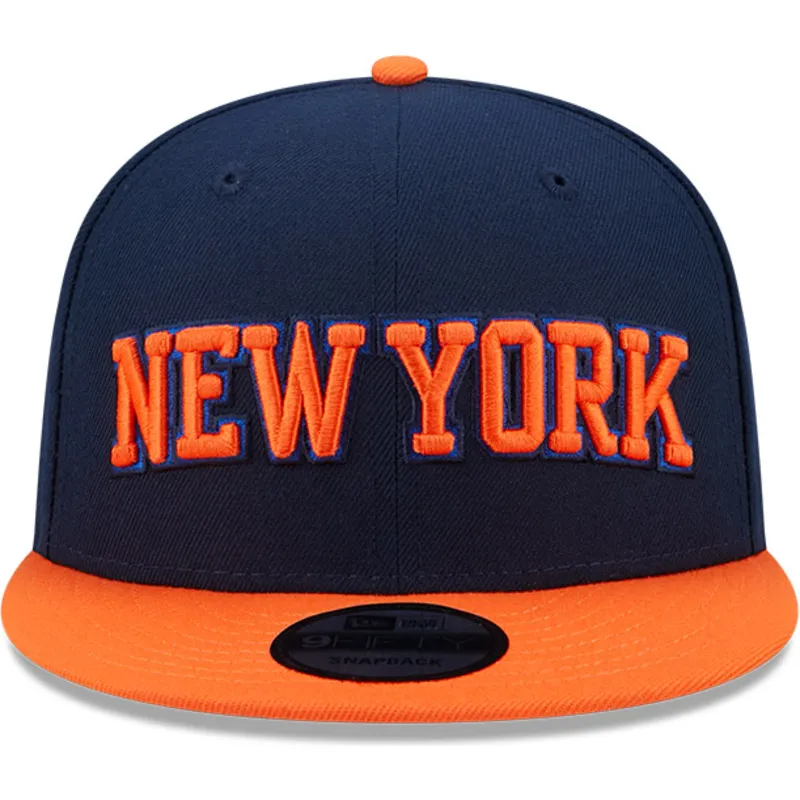 marineblaue-und-orangefarbene-flache-snapback-kappe-9fifty-statement-der-new-york-knicks-nba-von-new-era
